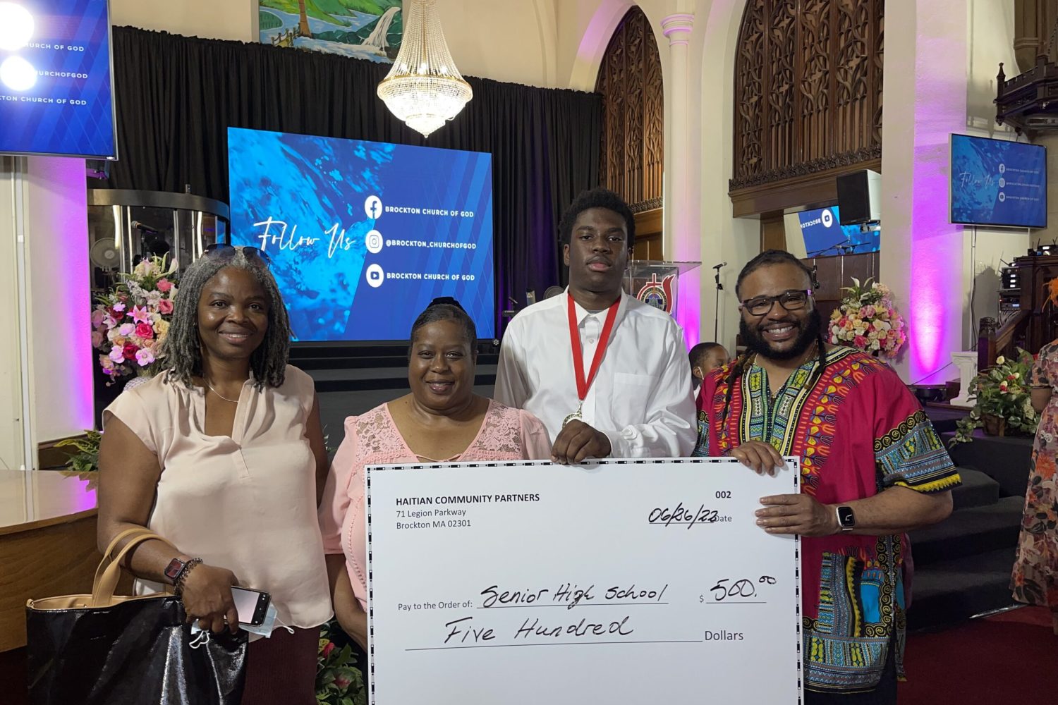 President Amedee gives $500 scholarship to college bound student.